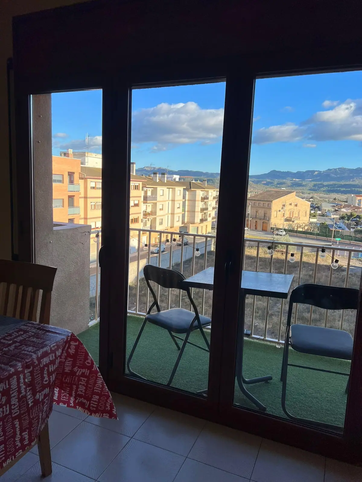 Table and chairs on the balcony overlooking the town