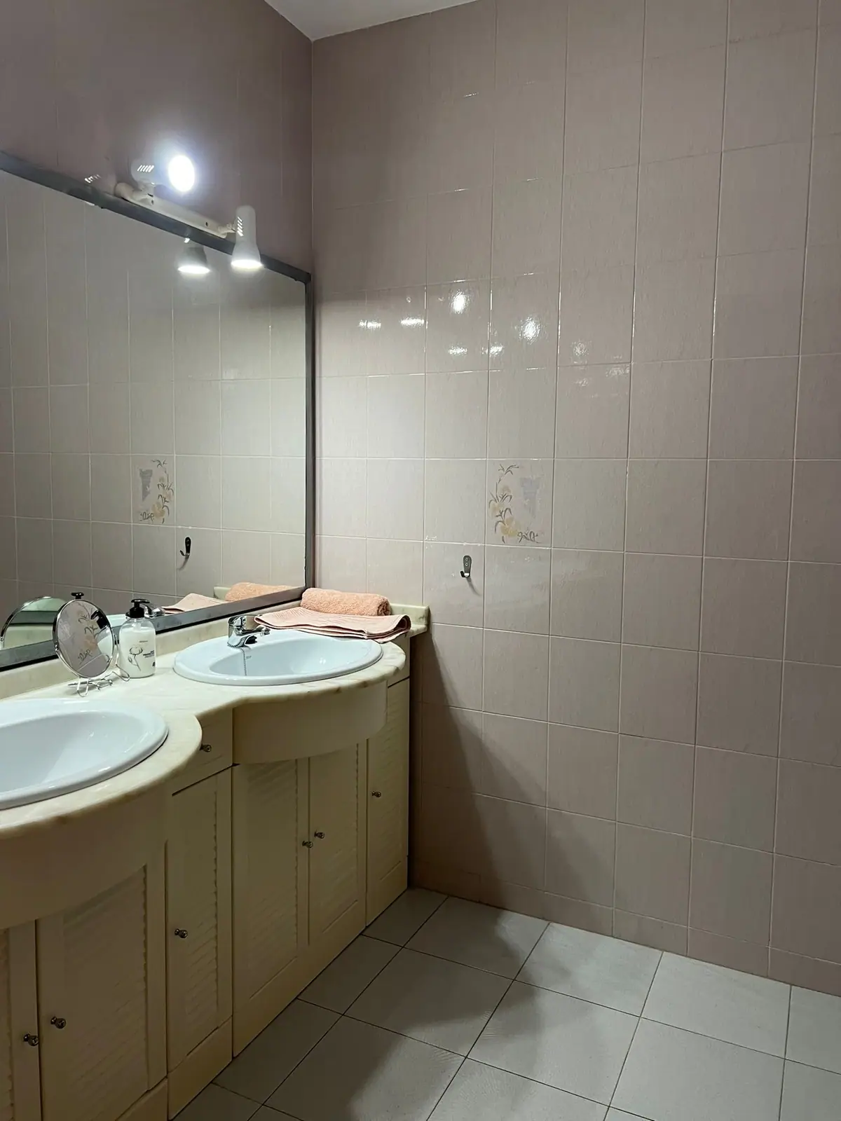 Bathroom with twin basins and a large mirror