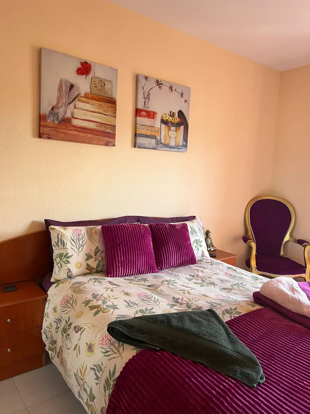 Double bedroom with framed prints above the bed