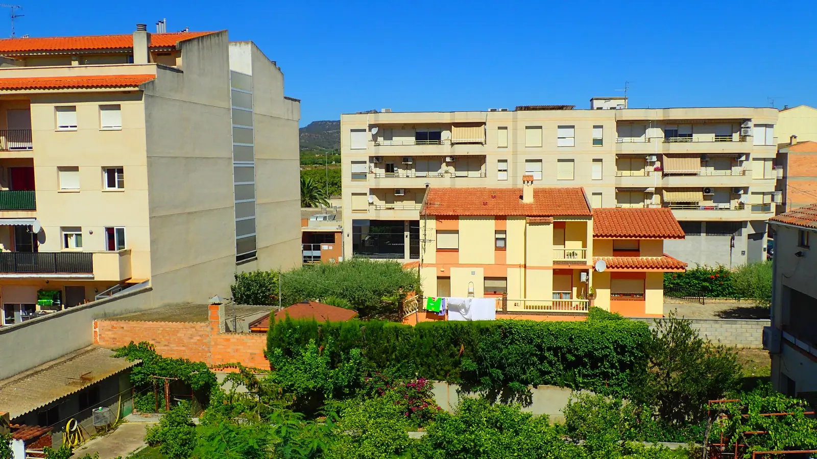The apartment building seen from the gardens below