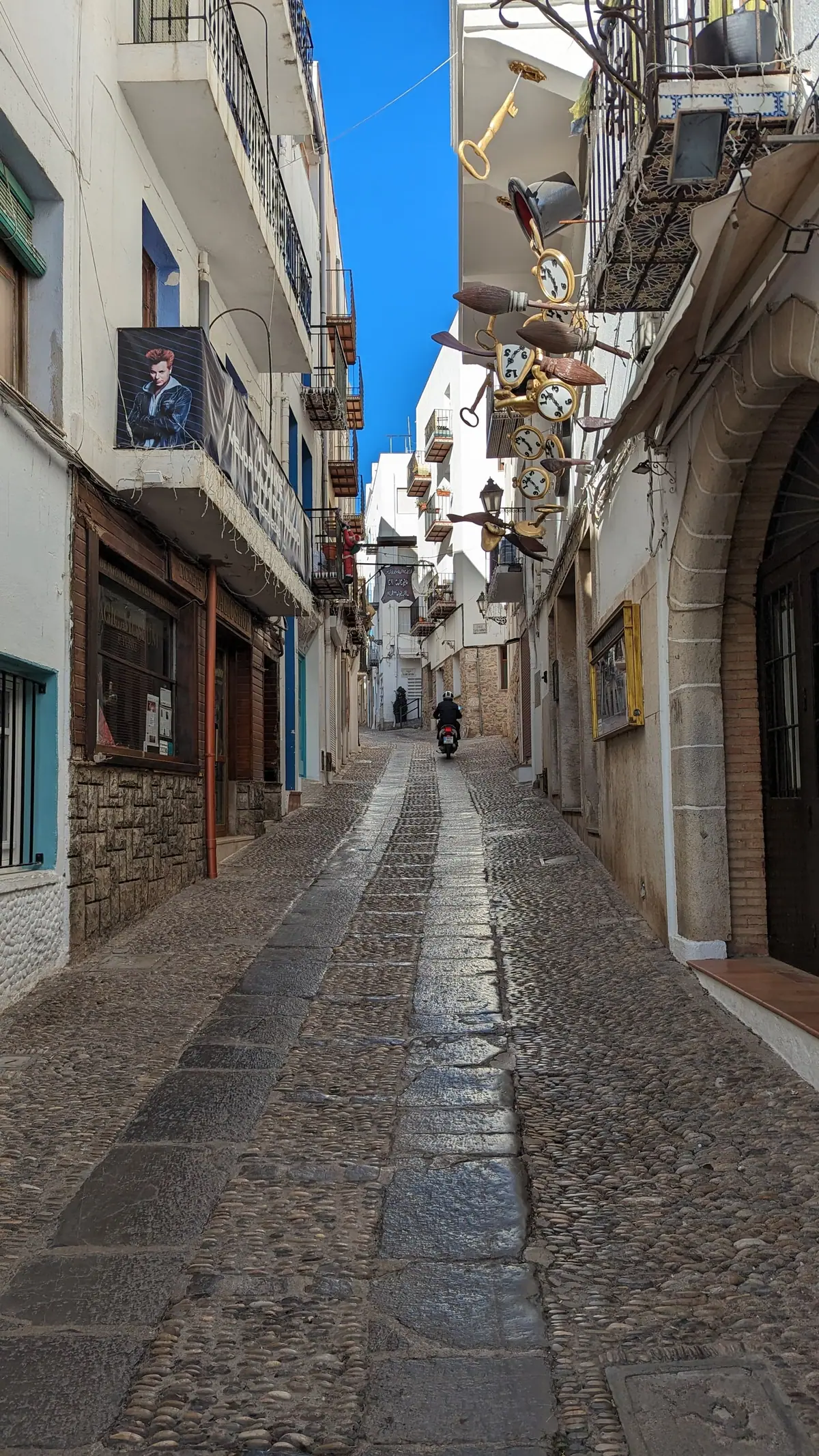 A narrow street winding through the old town